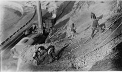 Workers-clearing-all-the-lose-cliff-face-so-as-to-make-it-safe-c1926